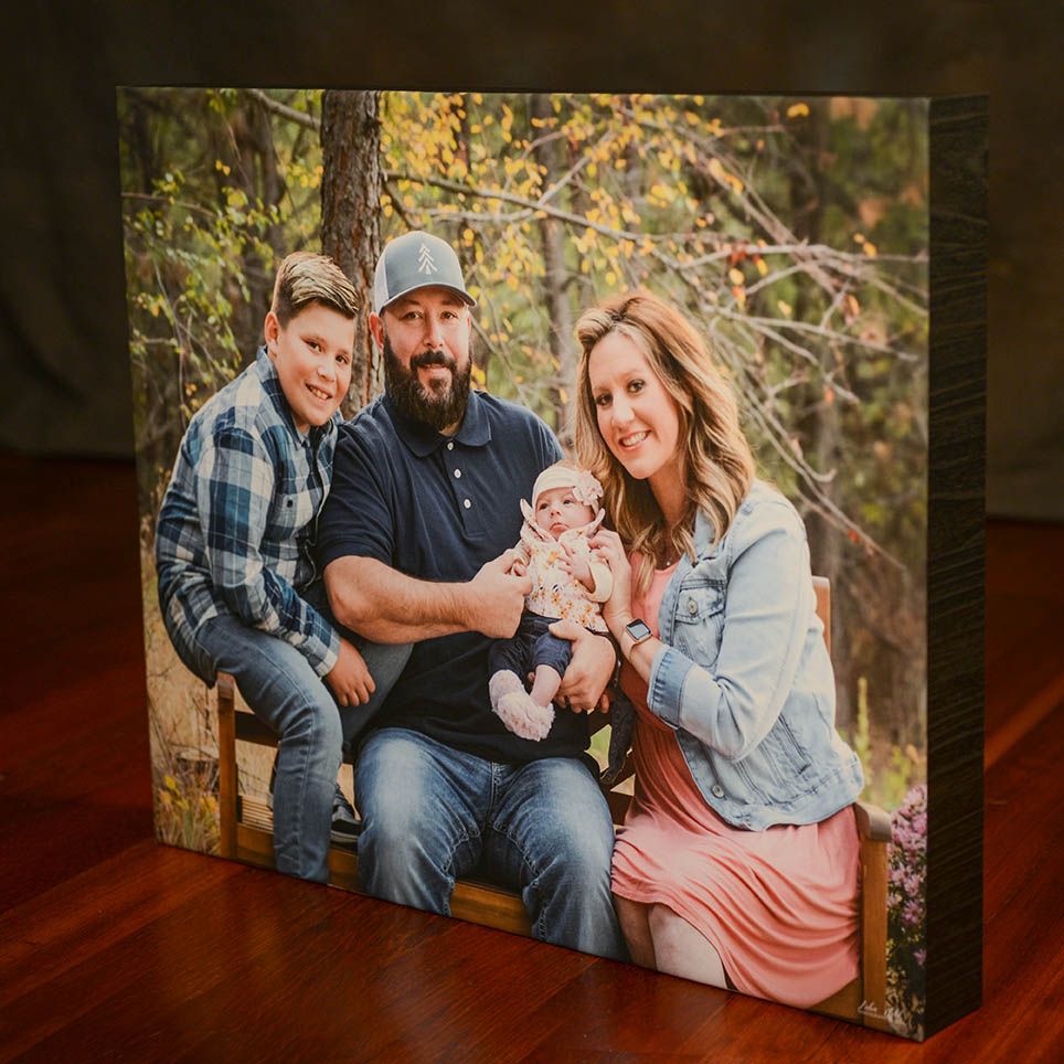Portrait canvas family of four with a newborn baby girl photographer Luba Wold