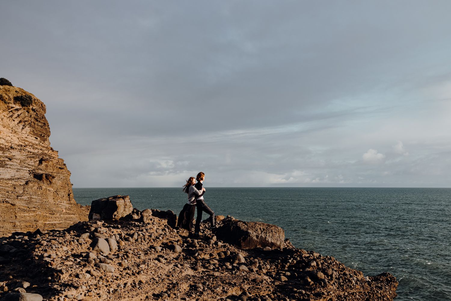 A couple and stunning view for their engagement shoot with Apertured Media-Auckland Wedding and Elopement Photographer