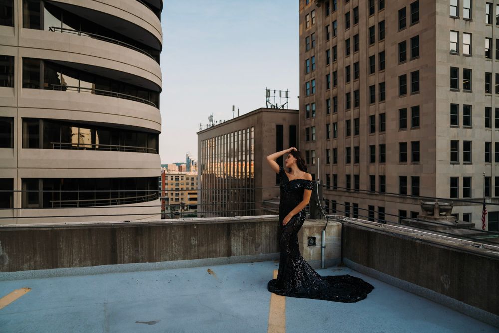 beautiful woman in black ball gown overlooking the city of cincinnati portrait photography ohio senior dayton