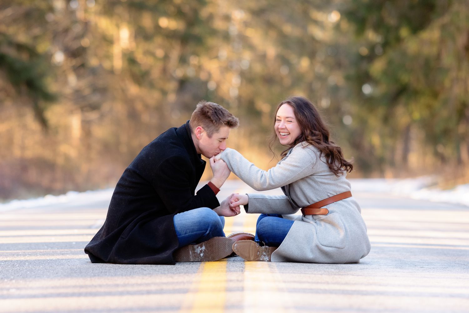 Couple Embracing and Smiling During Winter Engagement Photo Session at Cleveland Metroparks Hinckley Reservation
