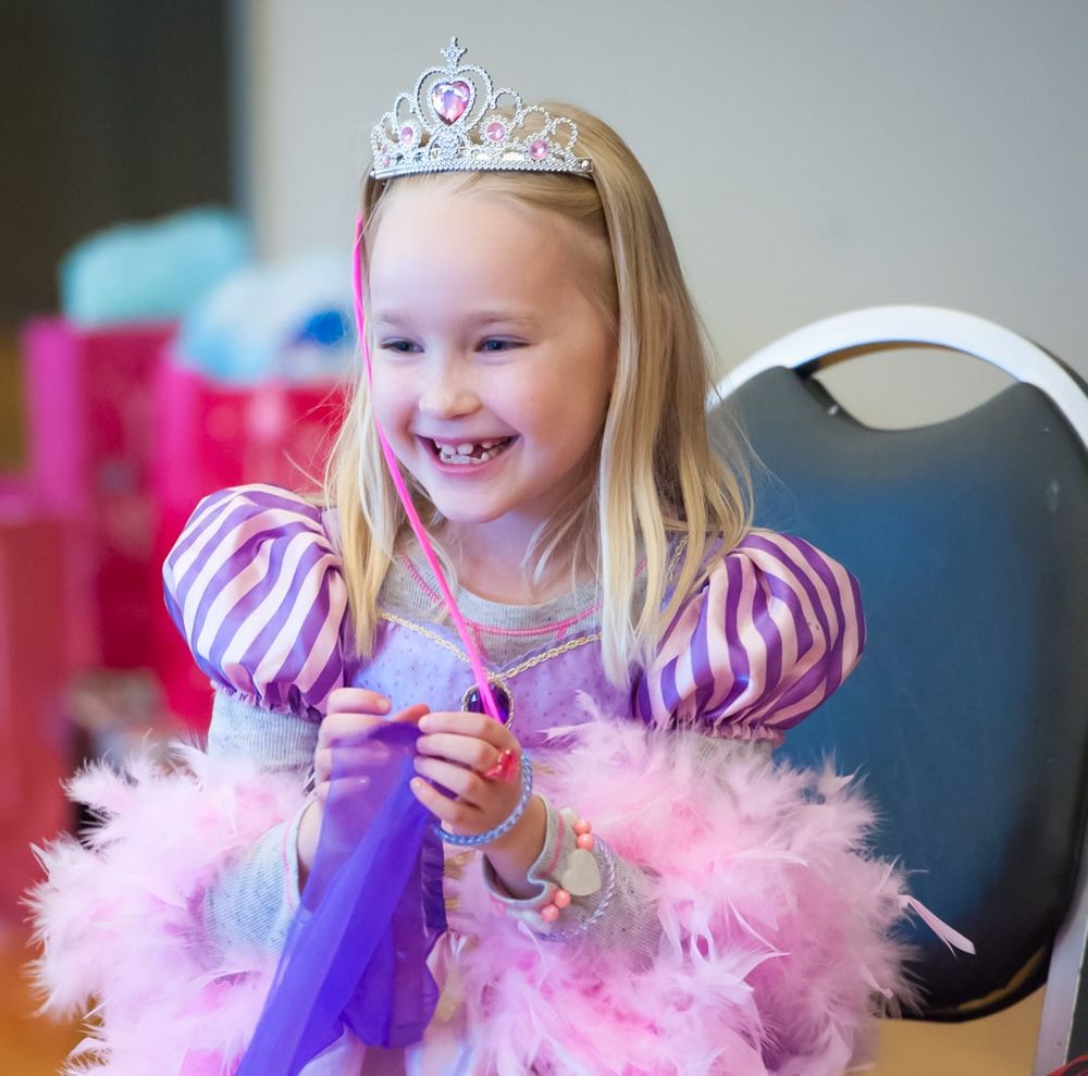 girl in princess costume at birthday party
