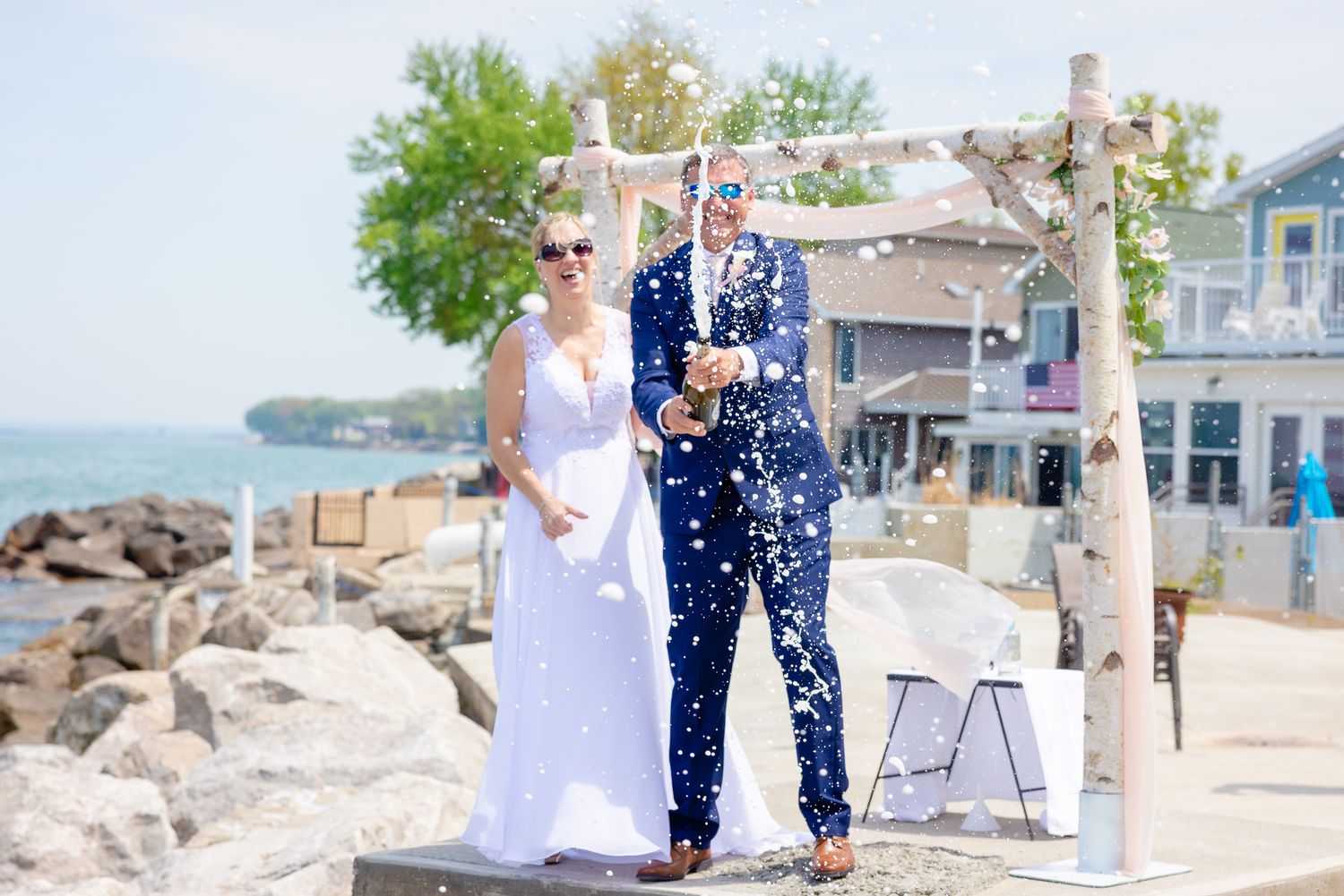 Champagne Spray Wedding Photo During Wedding in Huron, Ohio