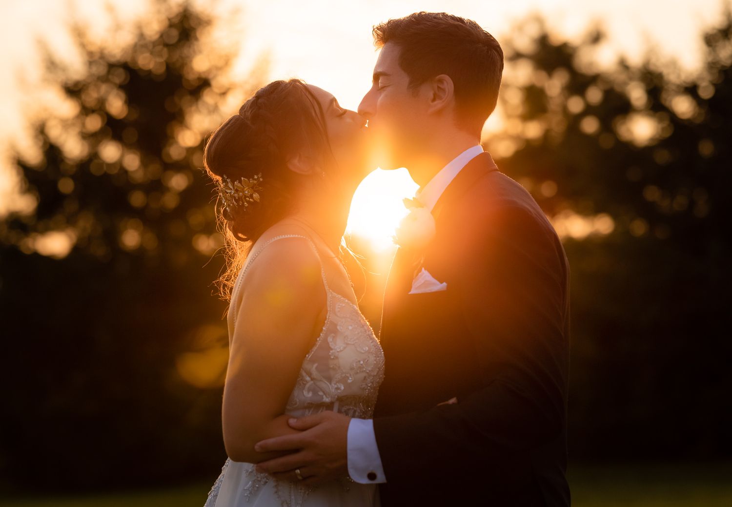 Close Up Wedding Photo of Couple Kissing During Golden Hour at Wedding at White Birch Barn in Medina, Ohio