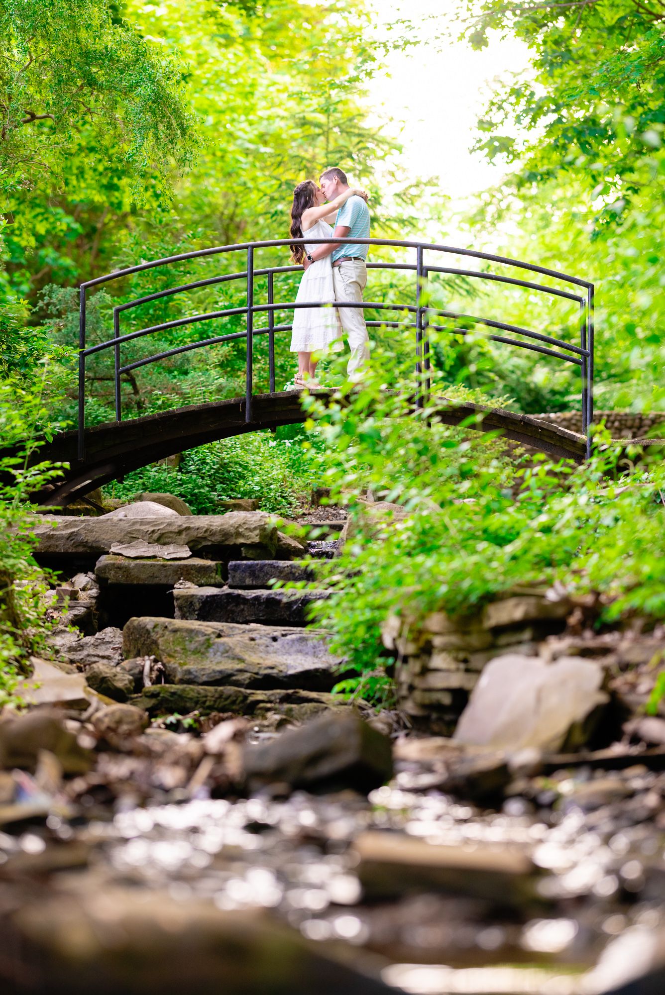 Engagement Photo of Couple on Bridge During Engagement Photo Session at Canton Garden Center in Canton, Ohio