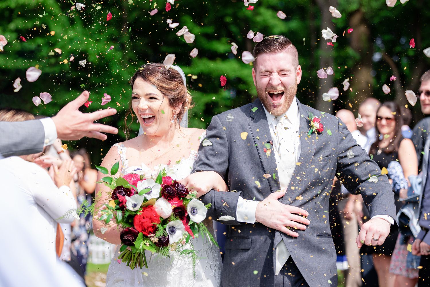 Epic Flower Petal Toss Photo During Wedding at Magnolia Spring Farm in Magnolia, Ohio