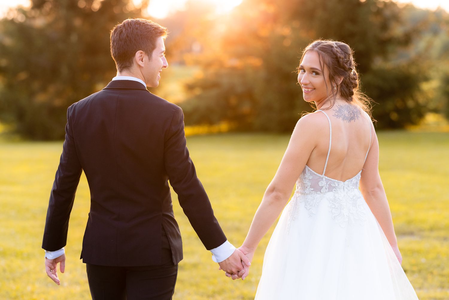 Wedding Photography of Couple Walking Away During Golden Hour at Wedding at White Birch Barn in Medina, Ohio