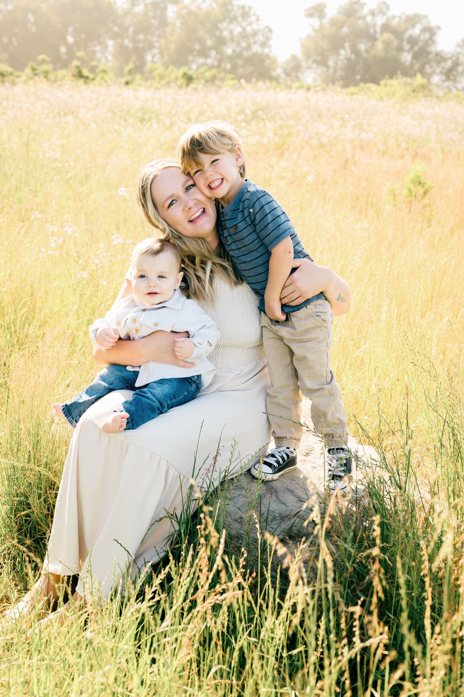 A family enjoys quality time together on a nature trail at golden hour.