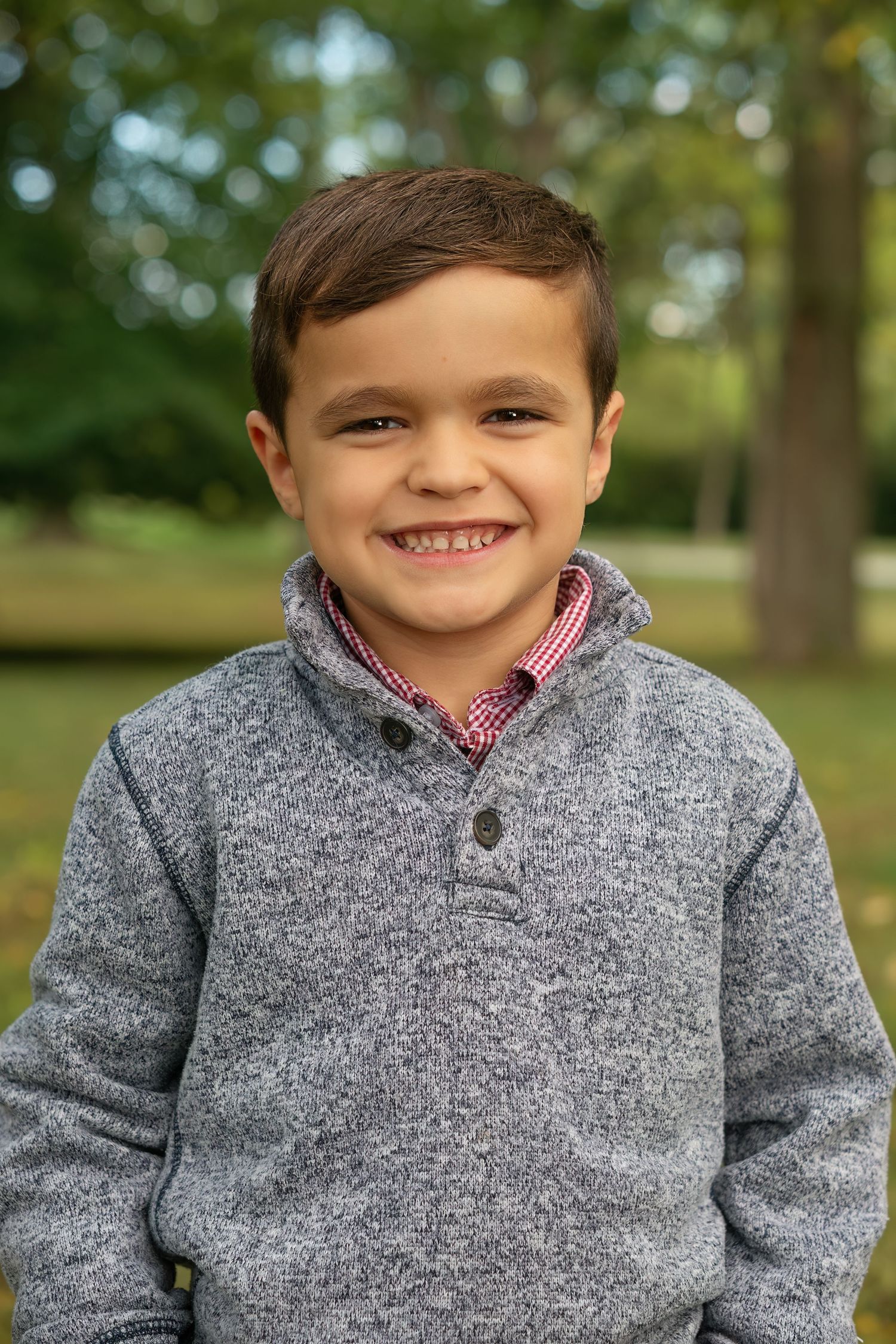 boy grins for outdoor portrait