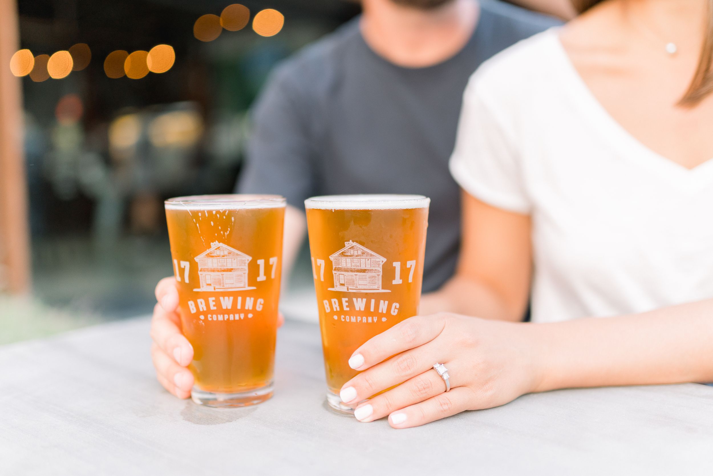 Des Moines Engagement photos at brewery in downtown Des Moines, Iowa with light and airy photographer Nicole Laing