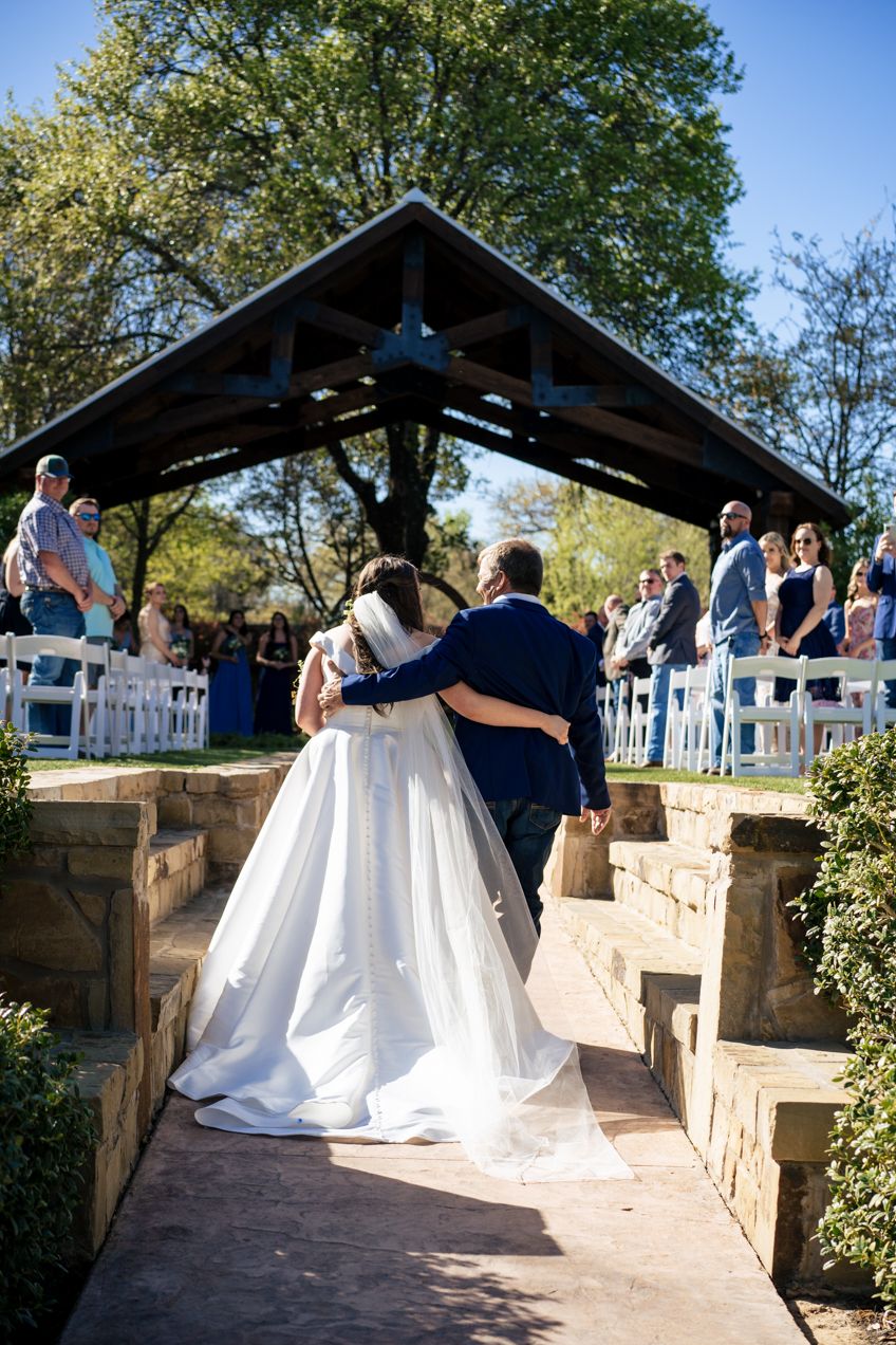 bride and her father walking down aisle