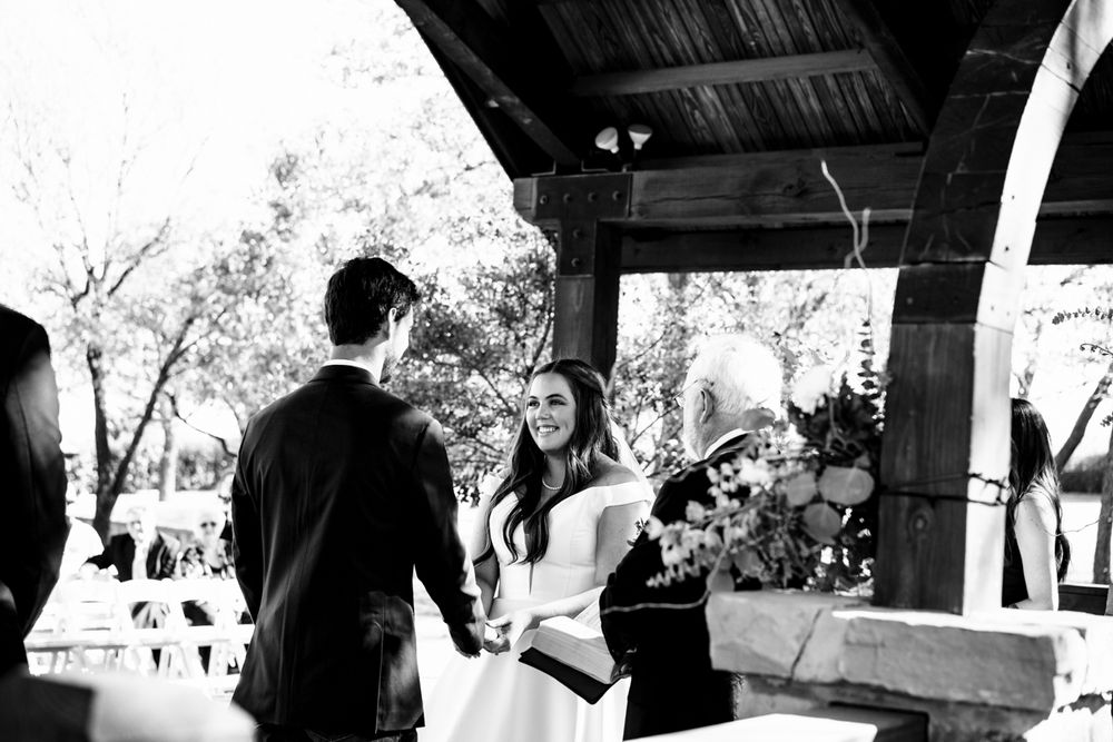 bride and groom holding hands