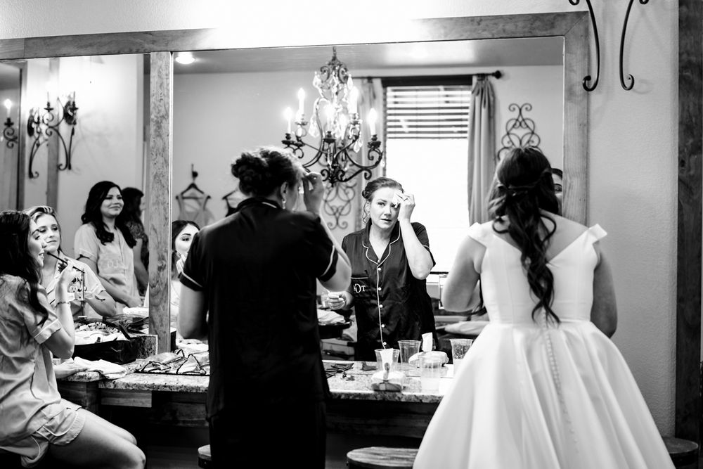 bride primping in mirror