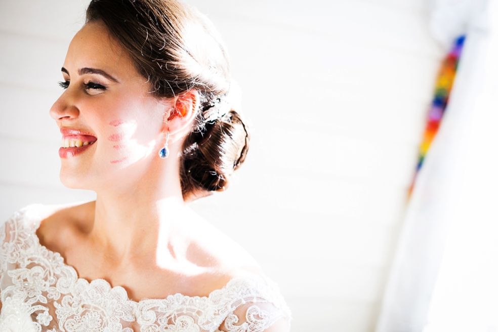bride getting lip stick mark on her face