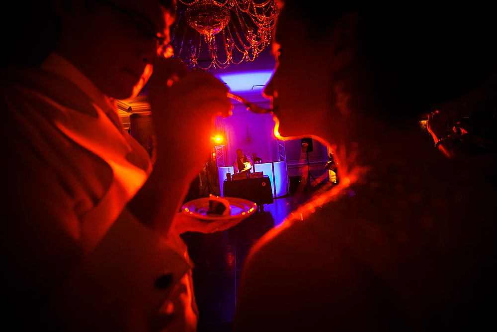 groom feeding bride wedding cake