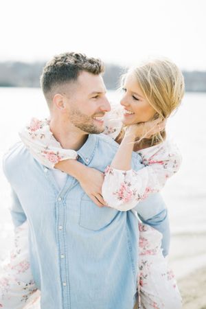 Light and airy film lakeside dock engagement session at Gray's Lake in Des Moines, Iowa