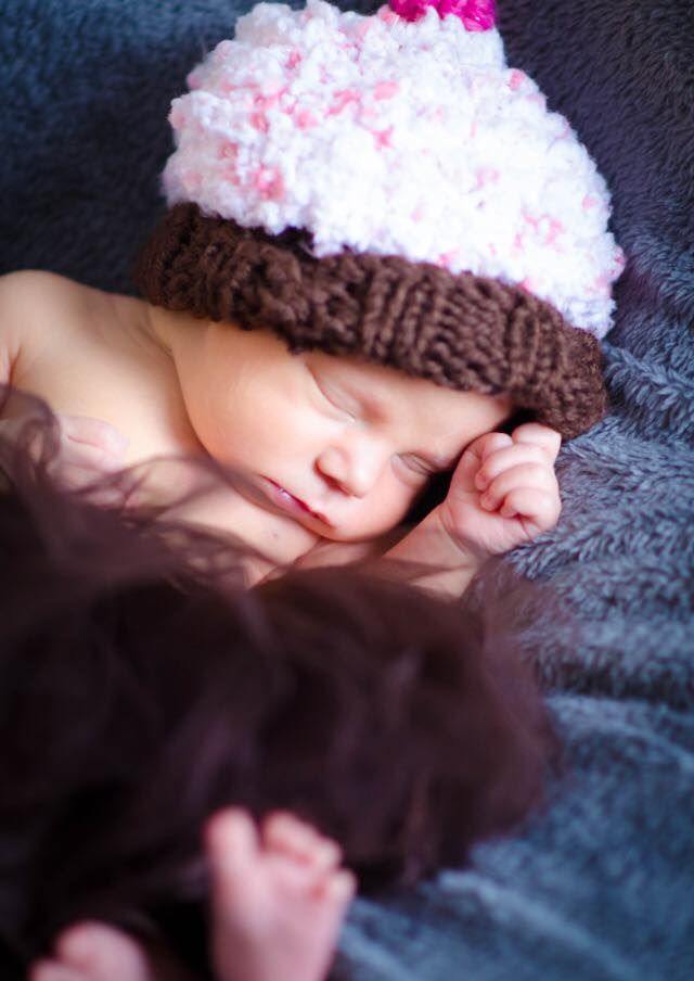 Baby Girl wearing cupcake hat