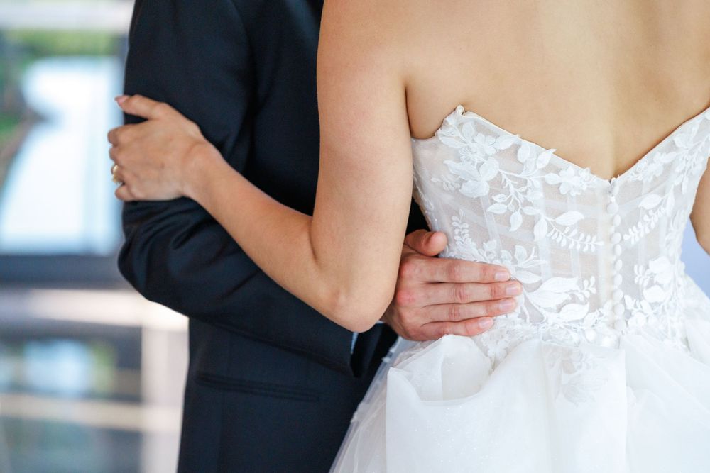 Cropped detail shots of a white lace wedding dress showing bodice and waist details in sequence.