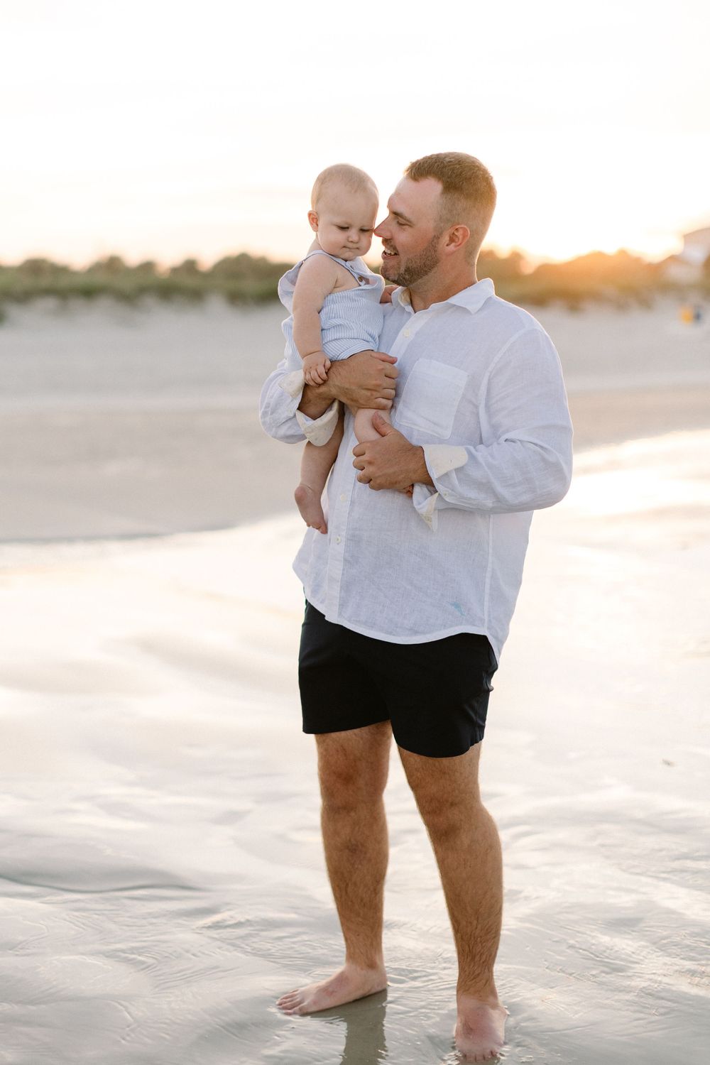 Tender parent-child moments captured in a series of beach photos during golden hour sunset.