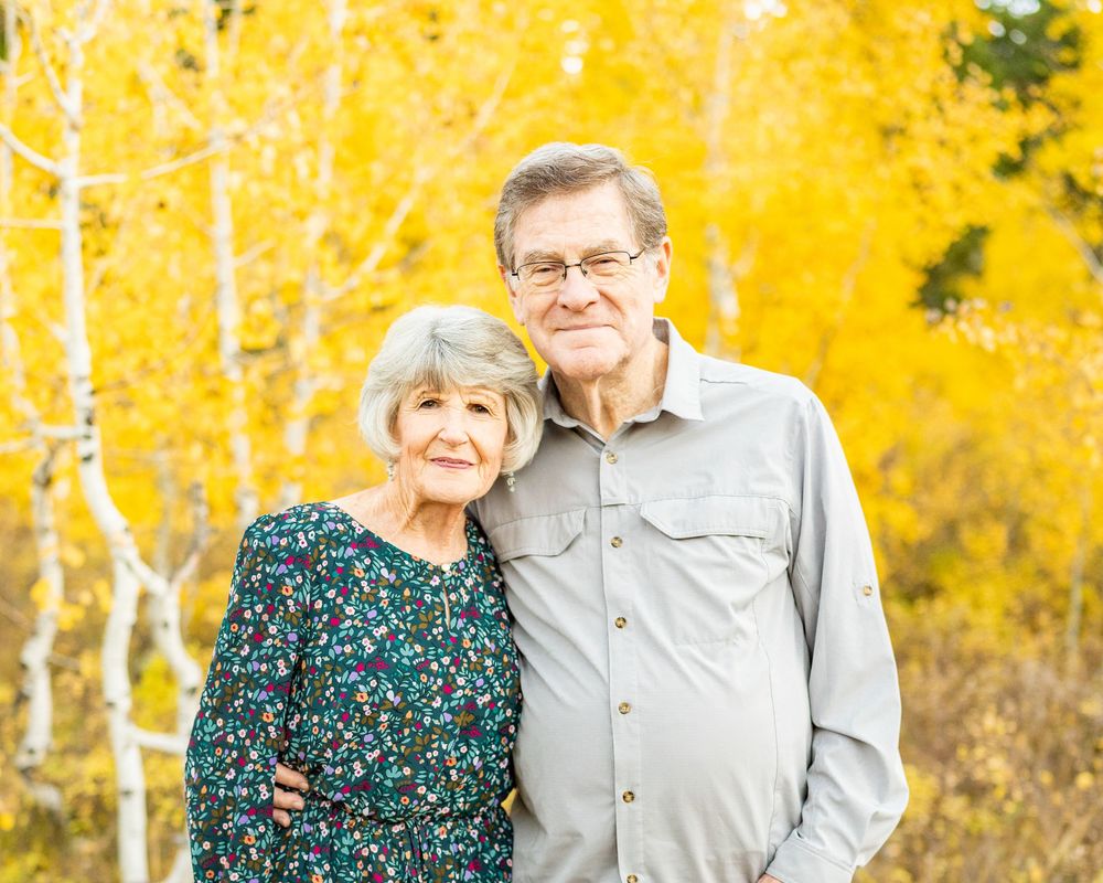 Grandparents hugging in nature at a spot at the Alpine Loop.