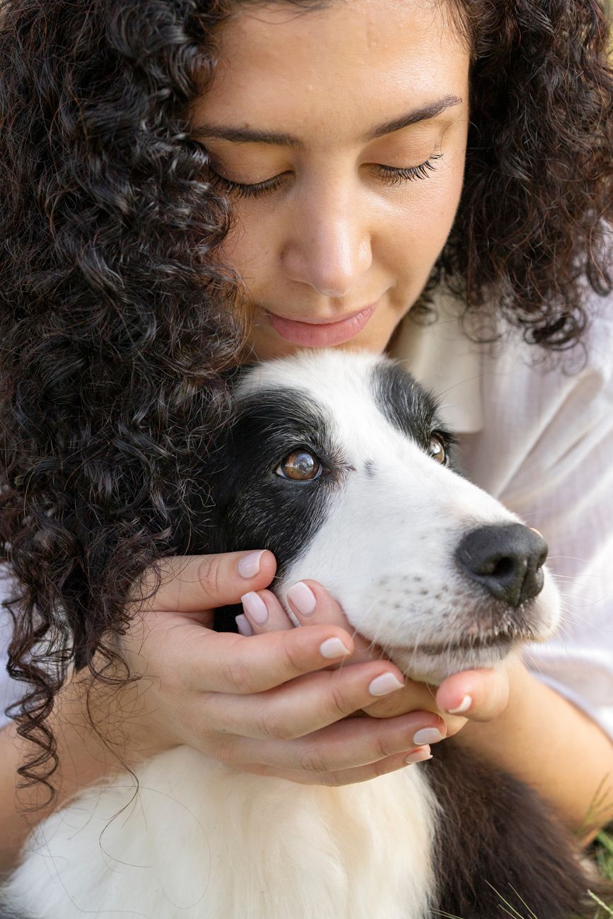 girl hugging her old border collie during a dog end of life photoshoot in the hills district