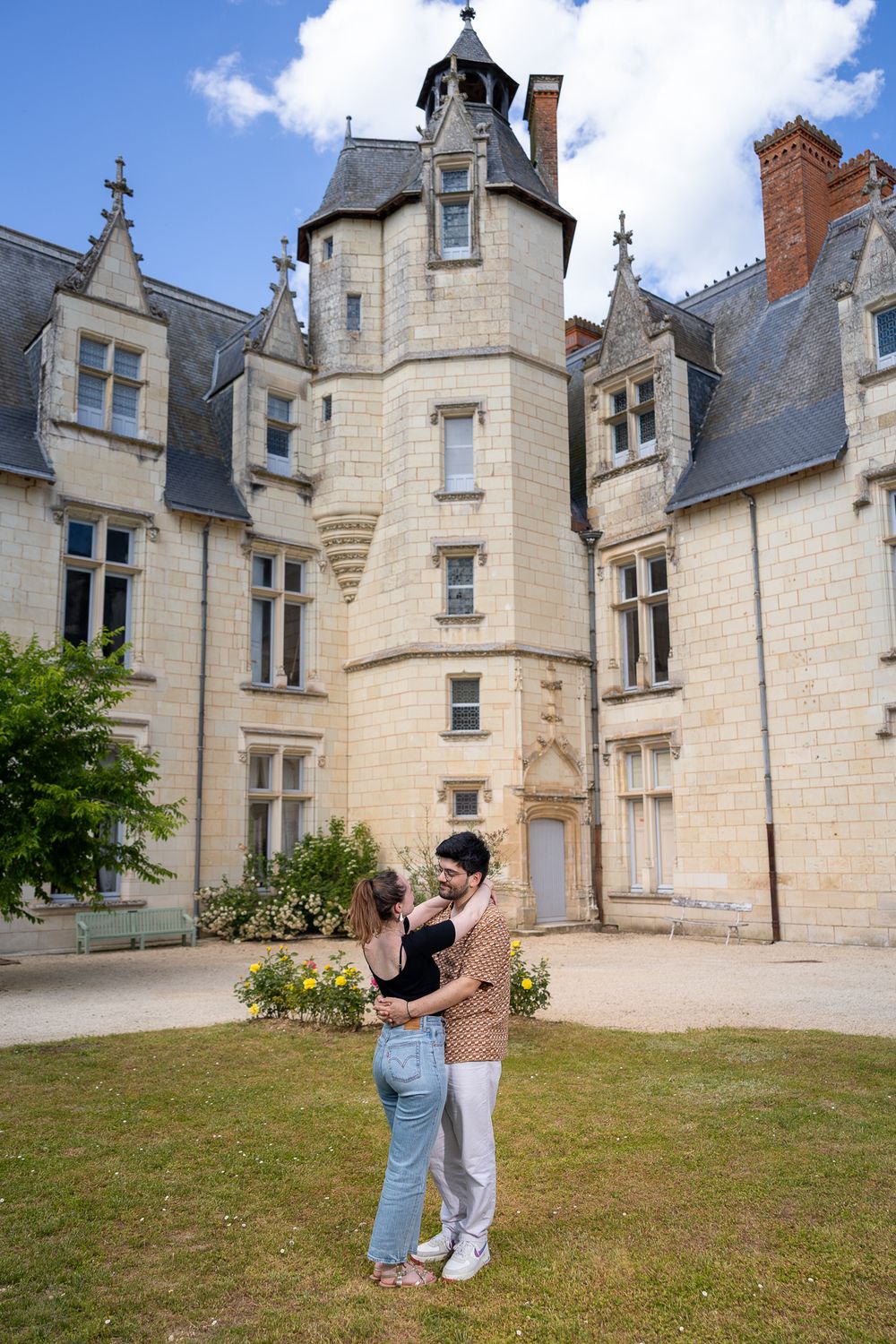 Historic French chateau with cream-colored limestone walls and gothic architectural details photographed from multiple angles.
