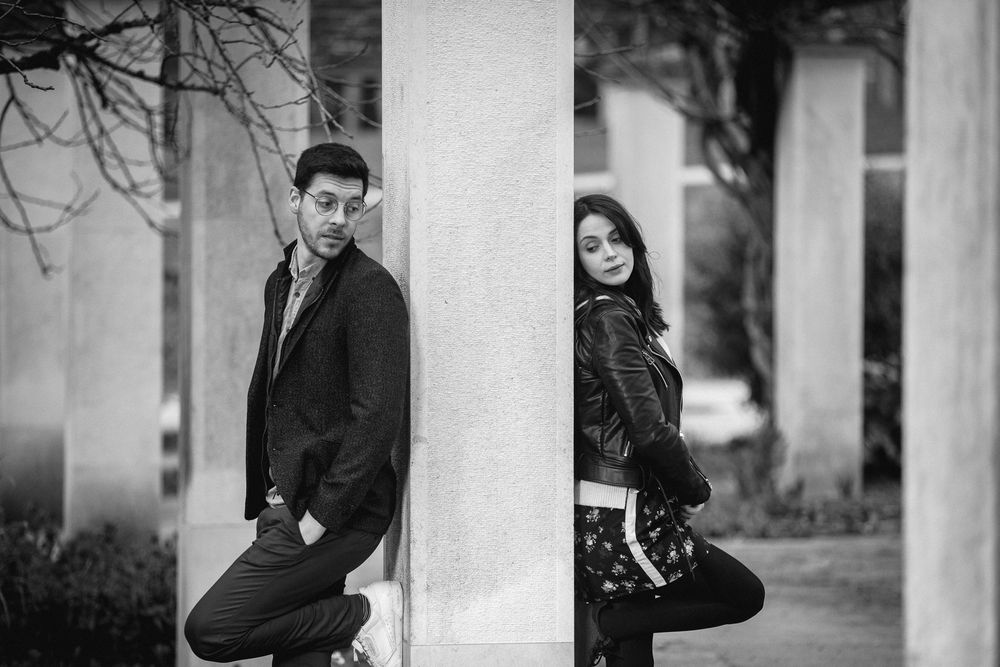 A black and white photo series showing outdoor portraits in a park setting with columns and natural elements.