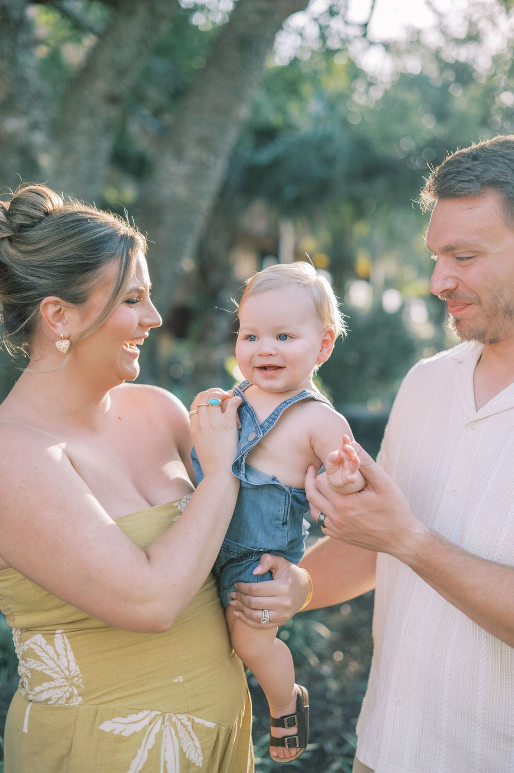 A heartwarming sequence of candid family moments showing tender interactions against a blurred outdoor backdrop.