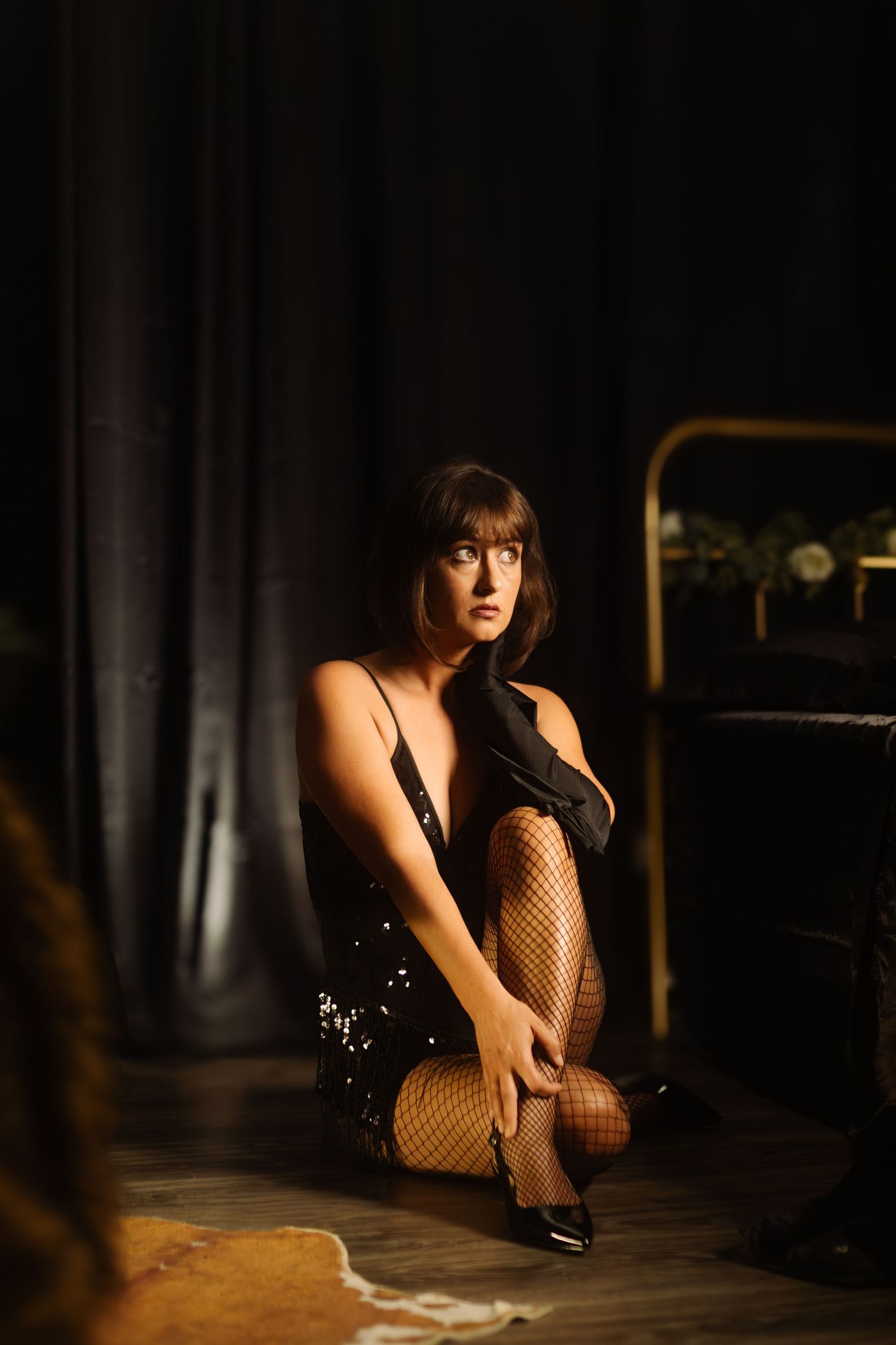 Vintage cabaret-inspired boudoir photo in Fort Worth studio, expressing vulnerability, confidence, and dramatic flair.