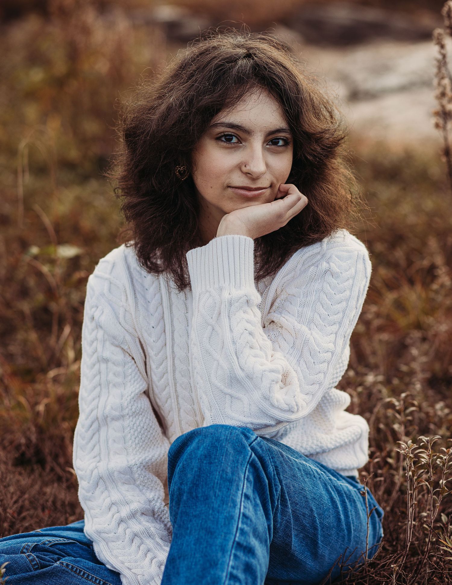 Professional senior photo of a woman in the grass