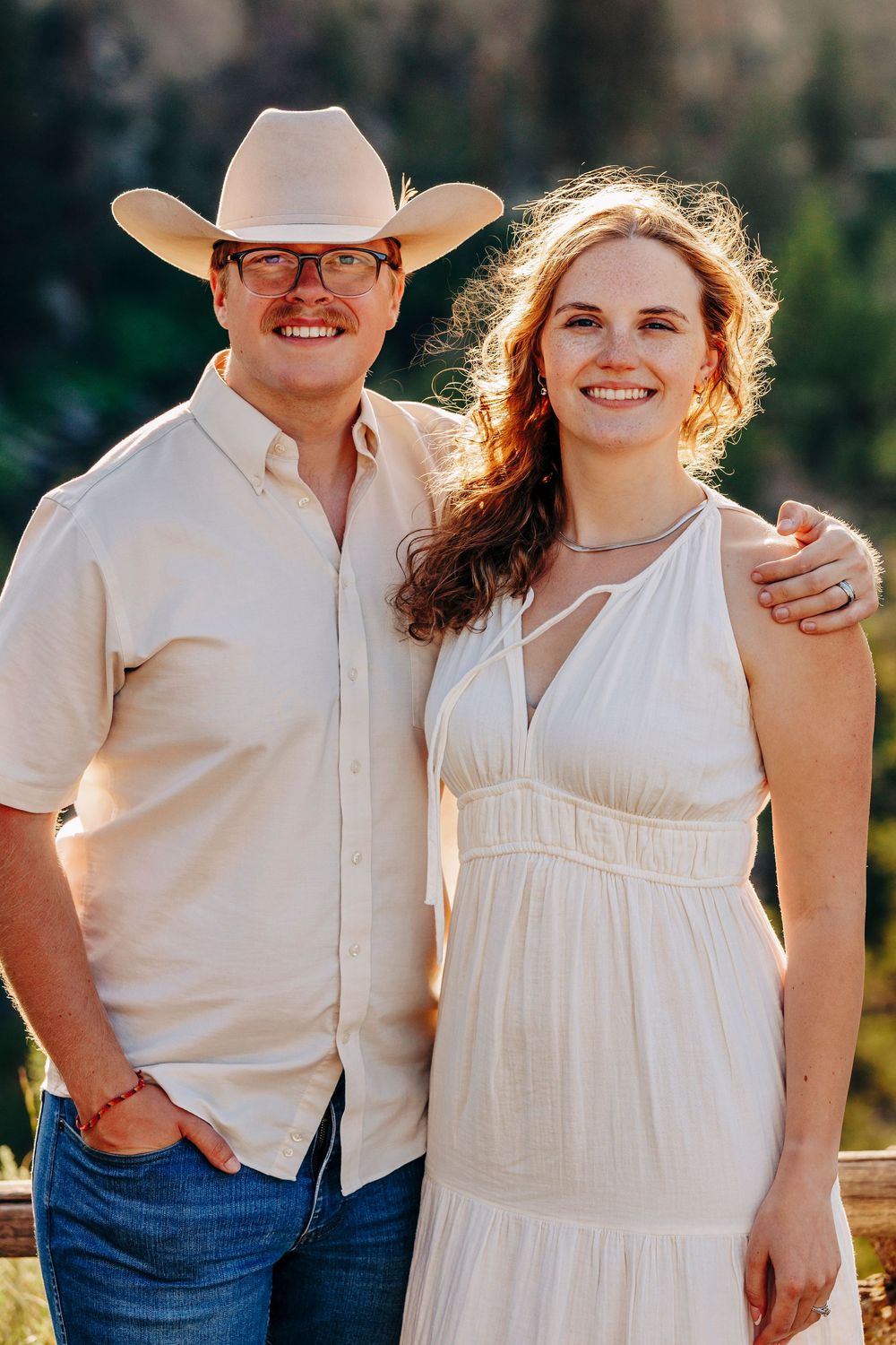 A romantic close-up outdoor photo shoot featuring white clothing and natural sunlight.