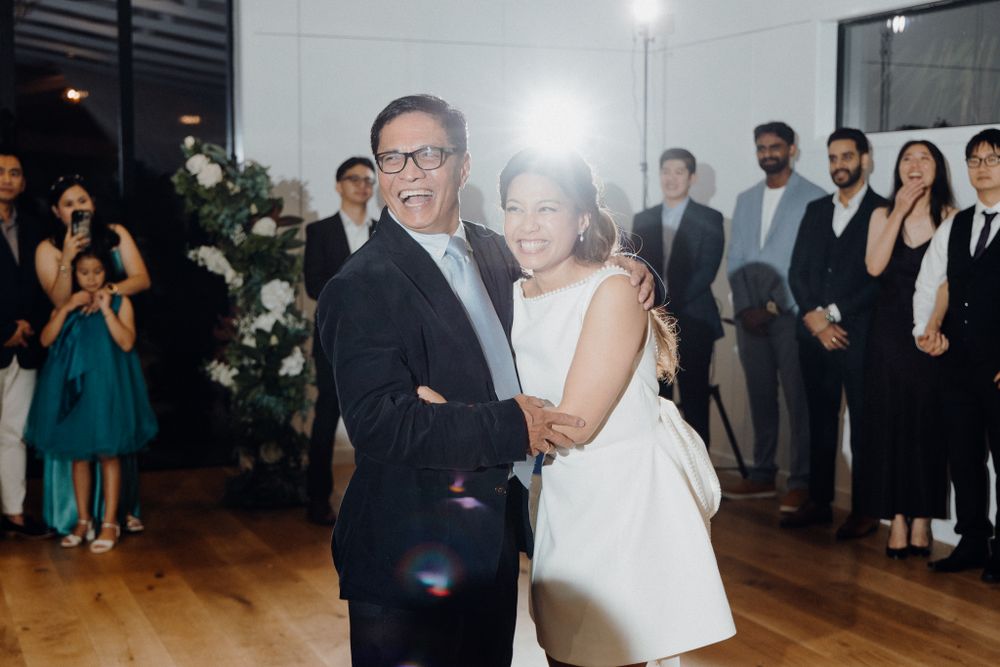 Dad and daughter share a sweet moment on her wedding day captured by Apertured Media Auckland Wedding Photographer.
