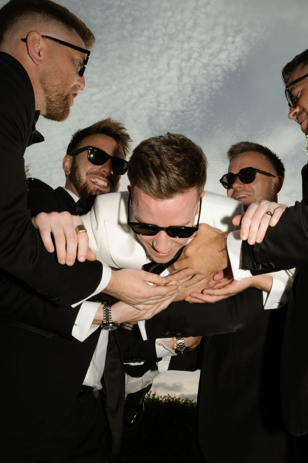 groomsmen carry groom at Primrose Hill farm Wedding- Photo by Primrose Hill Farm Wedding Photographer, Olivia J Morgan Photography