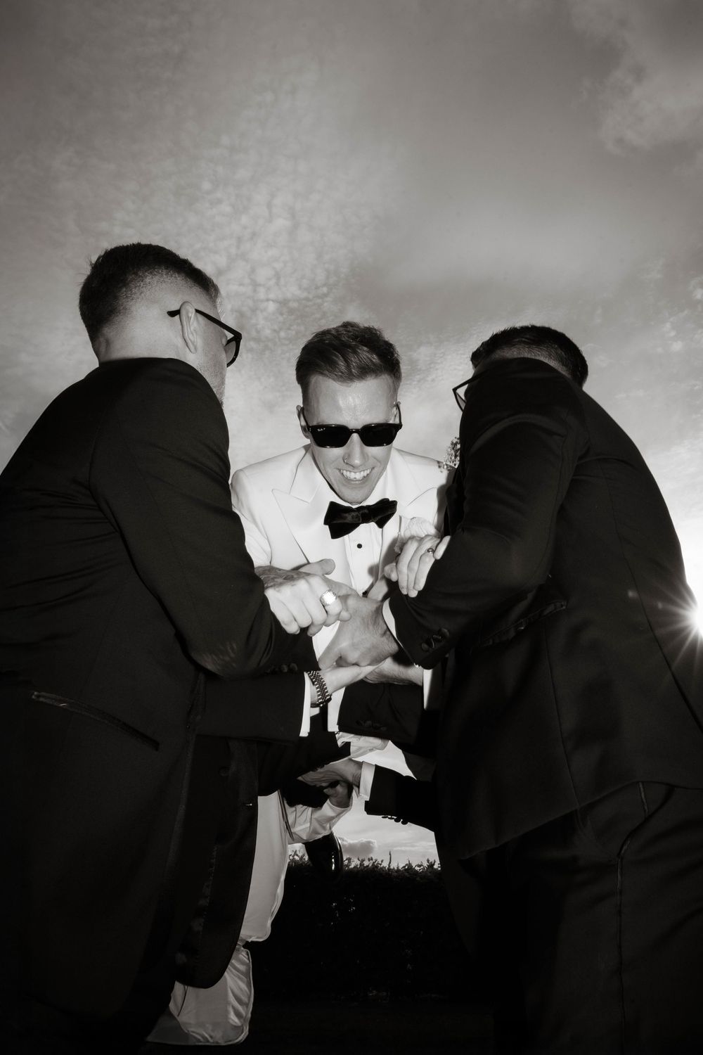 groomsmen carry groom at Primrose Hill farm Wedding- Photo by Primrose Hill Farm Wedding Photographer, Olivia J Morgan Photography