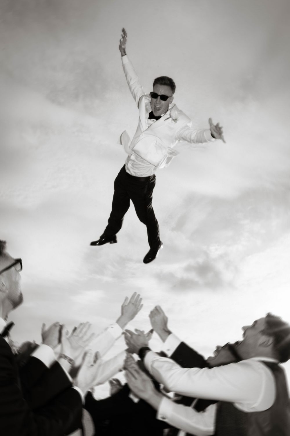 groomsmen throw groom in air at Primrose Hill farm Wedding- Photo by Primrose Hill Farm Wedding Photographer, Olivia J Morgan Photography