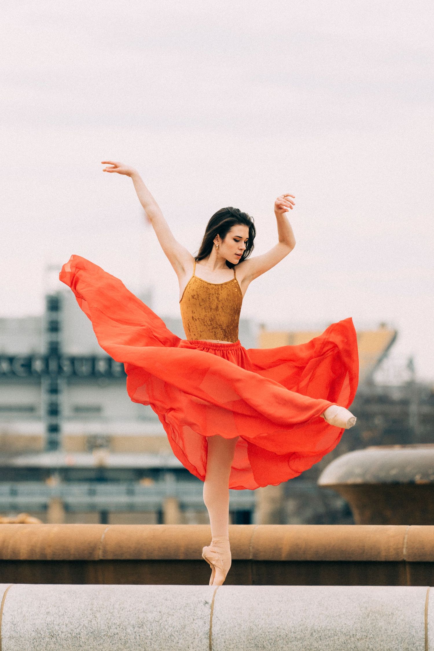 Ballerina photographed in motion against Pittsburgh’s industrial architecture pittsburgh dance photography
