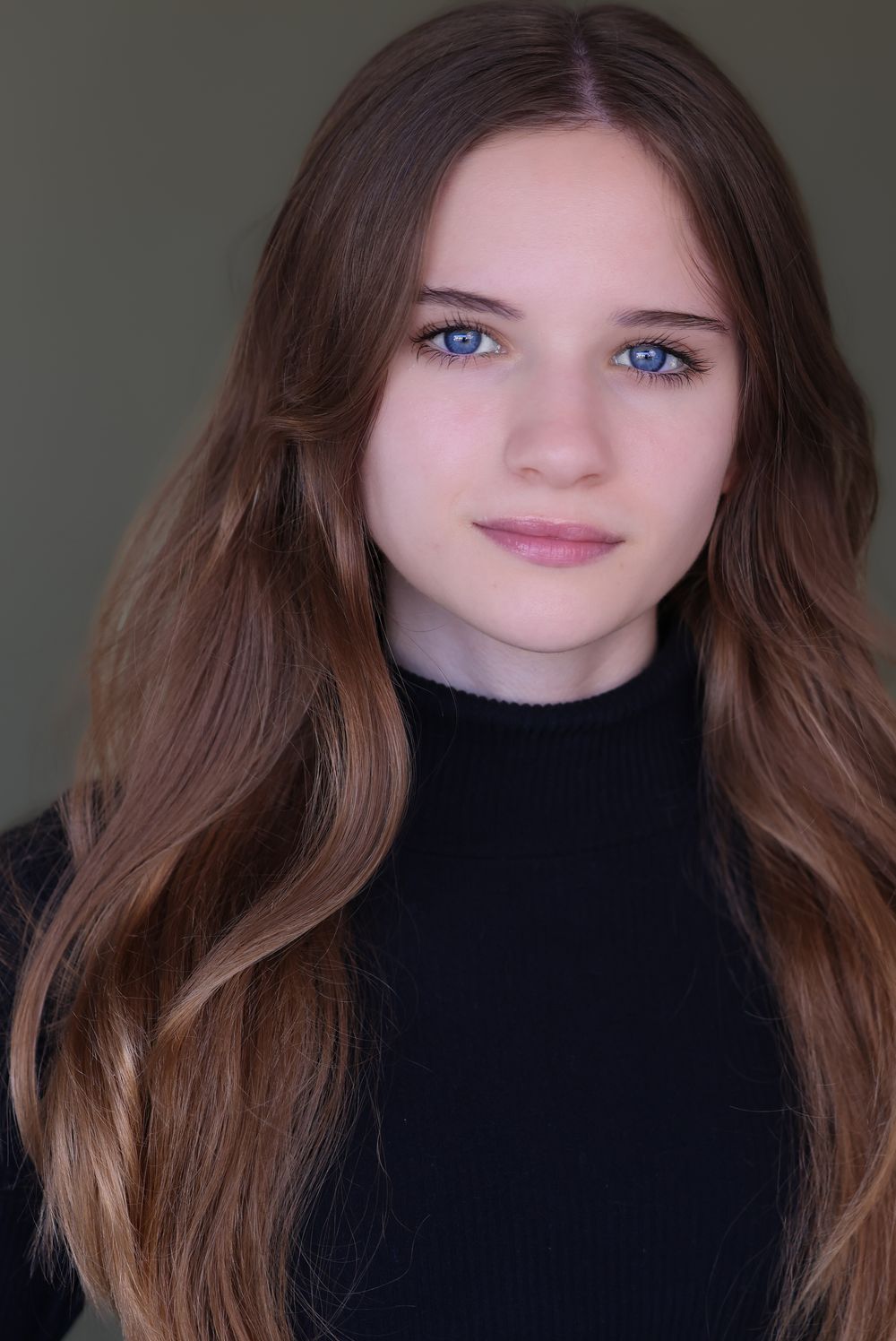 Close-up portrait series of a person with long brown hair wearing a black turtleneck sweater against a dark background.