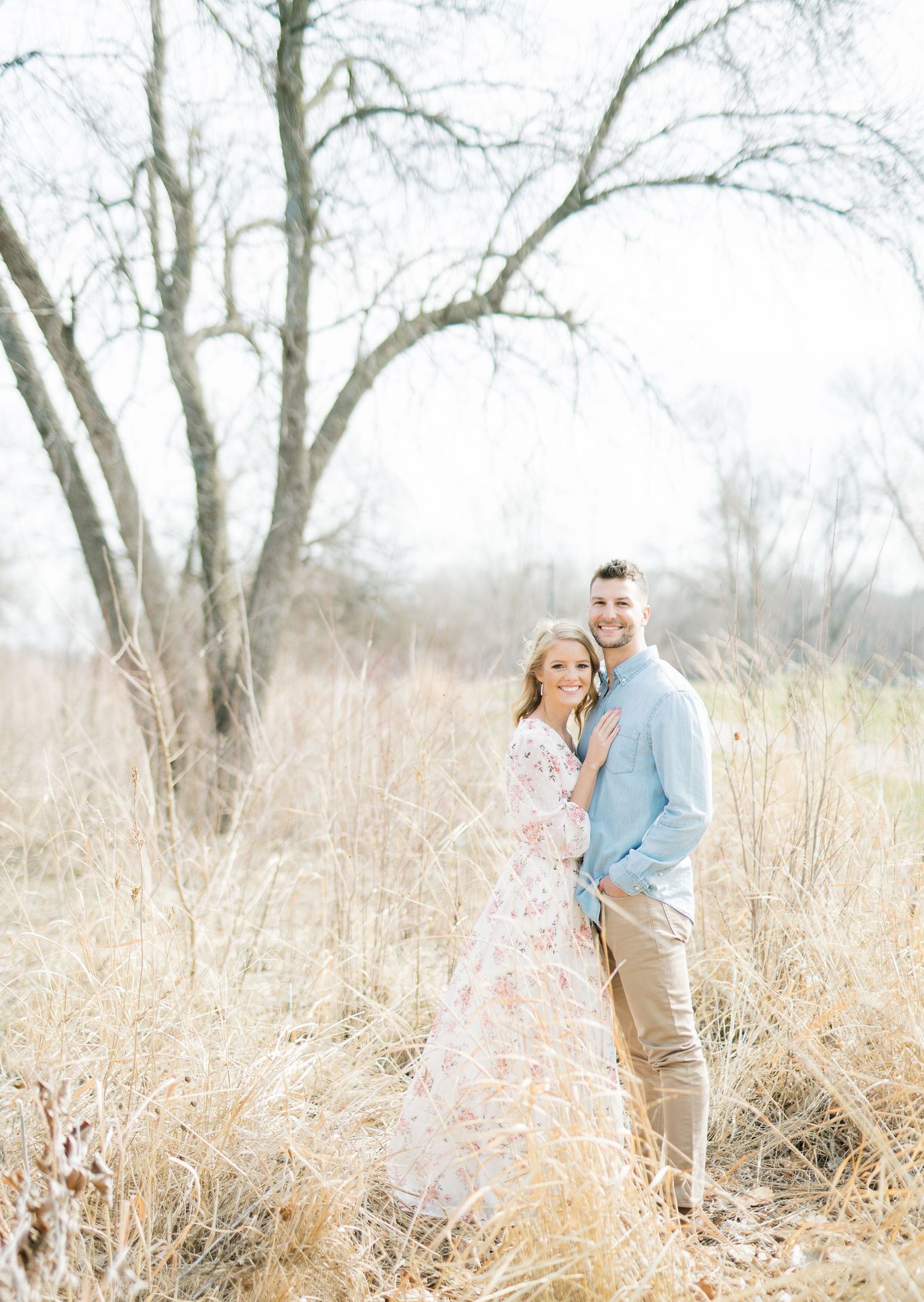 Light and airy film lakeside dock engagement session at Gray's Lake in Des Moines, Iowa
