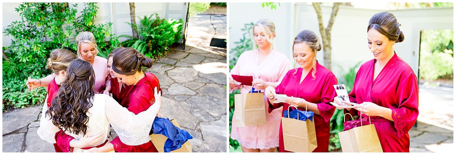 bridesmaids in red and blush robes opening gifts from their NorCal bride