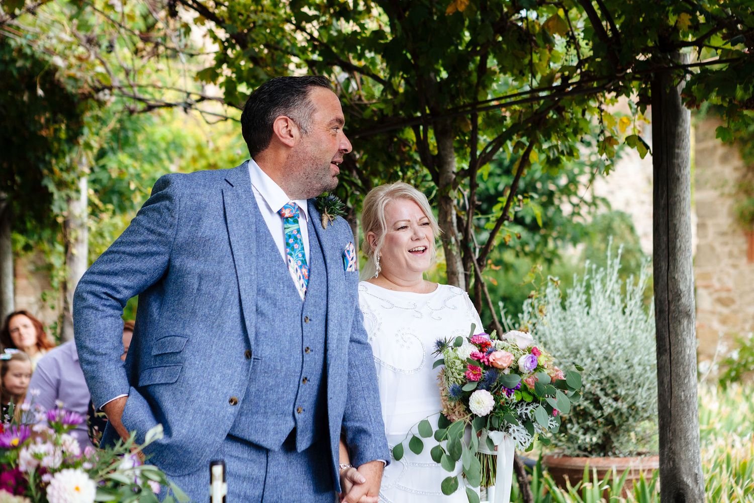 a sweet moment during the wedding ceremony as captured by Tuscany photographer Elizabeth Armitage
