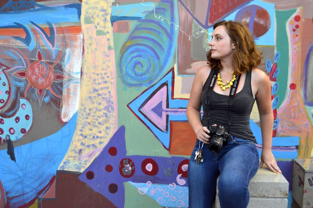 Colorado Springs Boudoir Photographer Elise Odom Portrait in front of a beautiful graffiti wall in a Downtown alley way