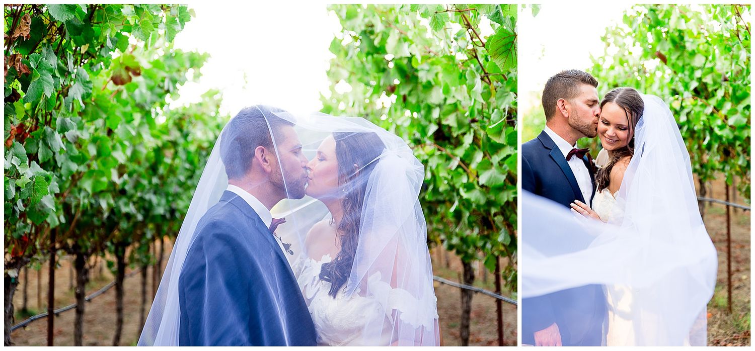 bride and groom kiss in vineyard in September at Pennyroyal farm