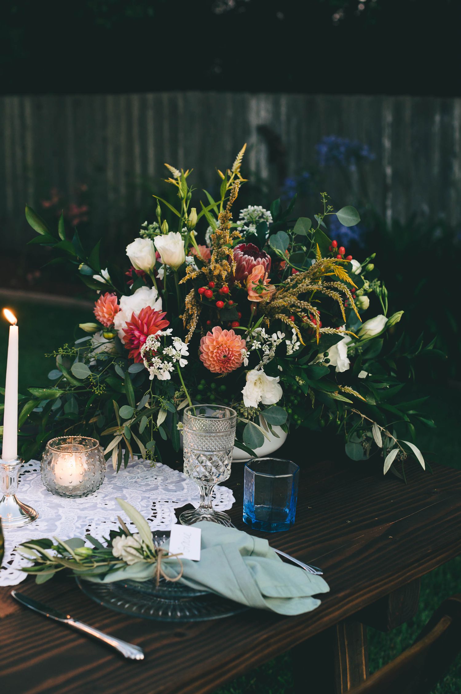 DIY decor with candles and colorful glass wear at this intimate backyard wedding in Santa Cruz