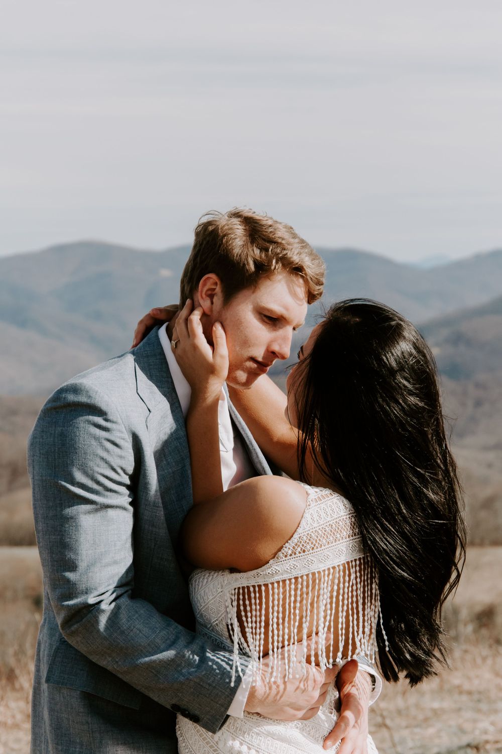 man looking at his new wife at the end of their smoky mountains elopement