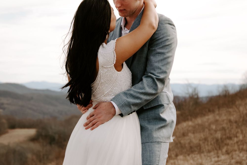 couple looking at each other during their mountain elopement
