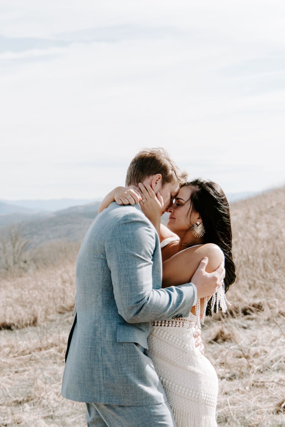 couple embracing in the mountains during their Blue Ridge Mountains elopement