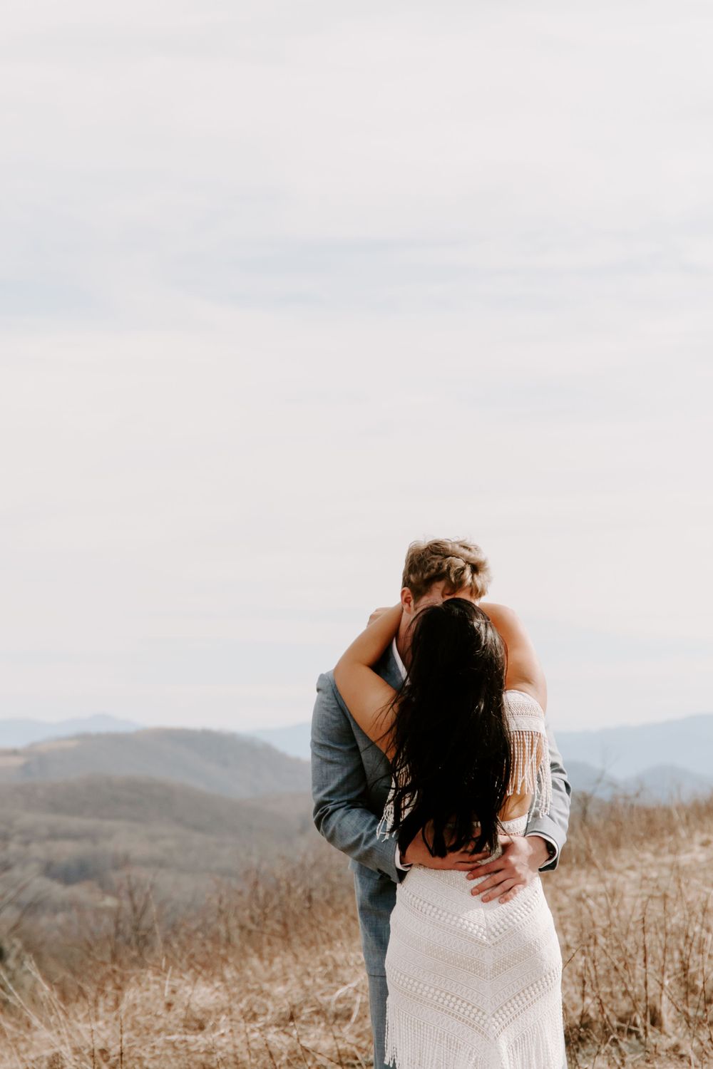 couple kissing on the mountains during their blue ridge mountains elopement