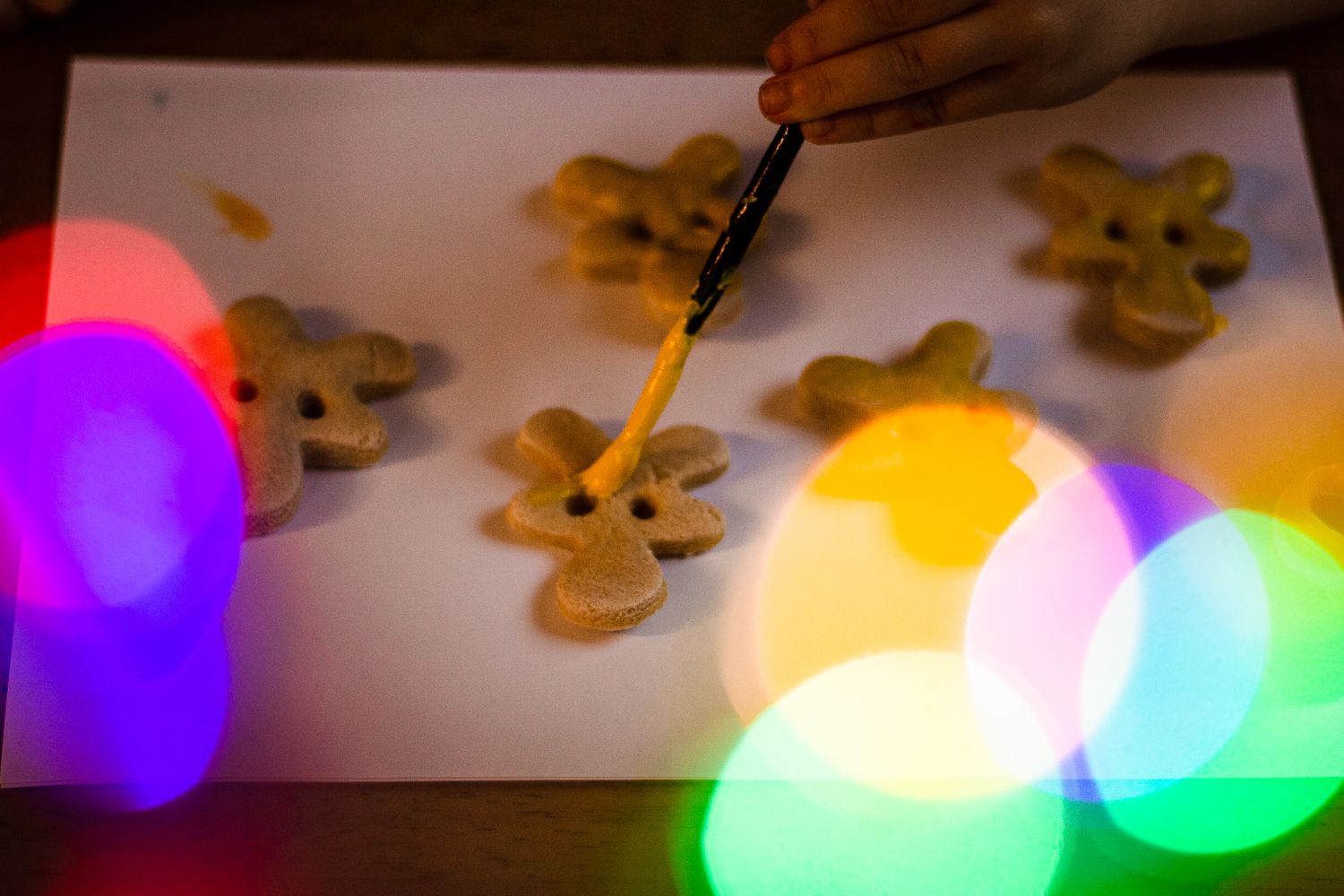 Salt dough Christmas ornaments being painted.