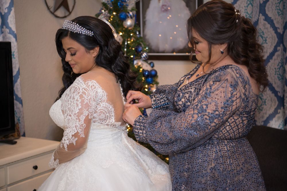 Bright getting dressed with her mom before the big day. McAllen wedding photography