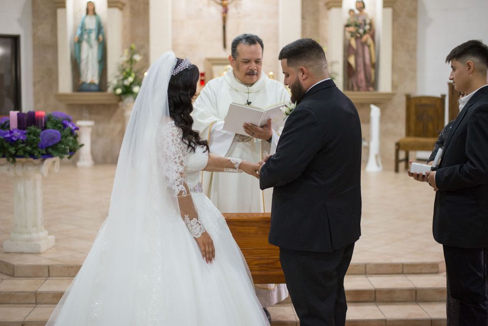 Bride and groom exchanging rings. Mcallen photography