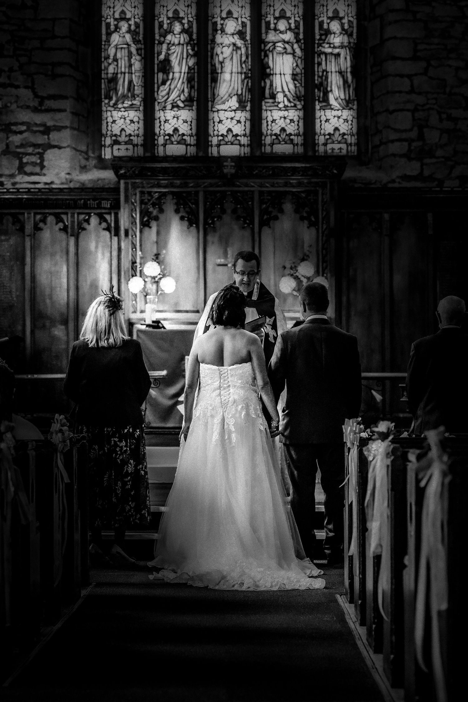 Black and white image of church wedding service in Manchester